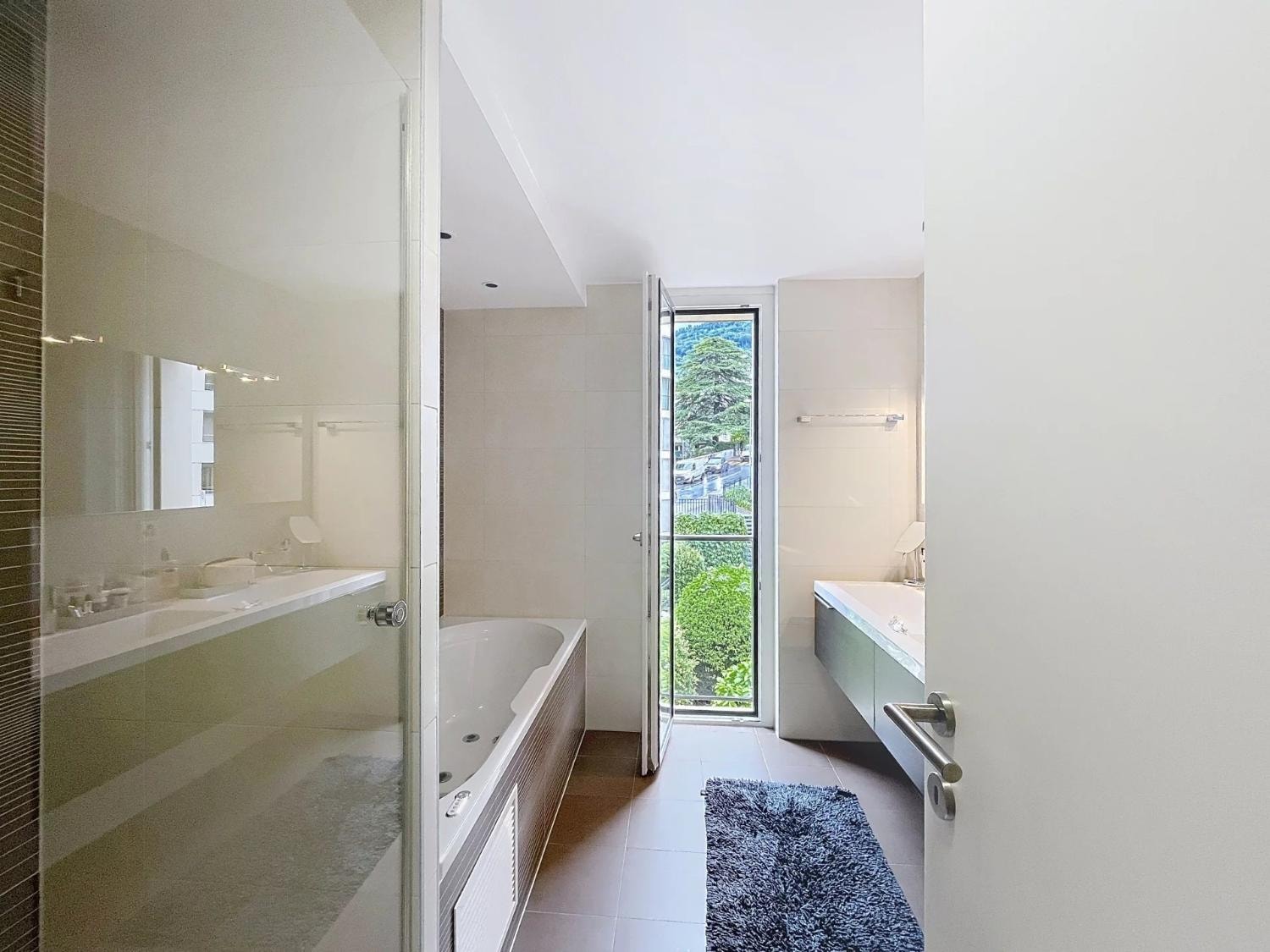 Master bathroom with jacuzzi bath and garden window, Le National, Montreux