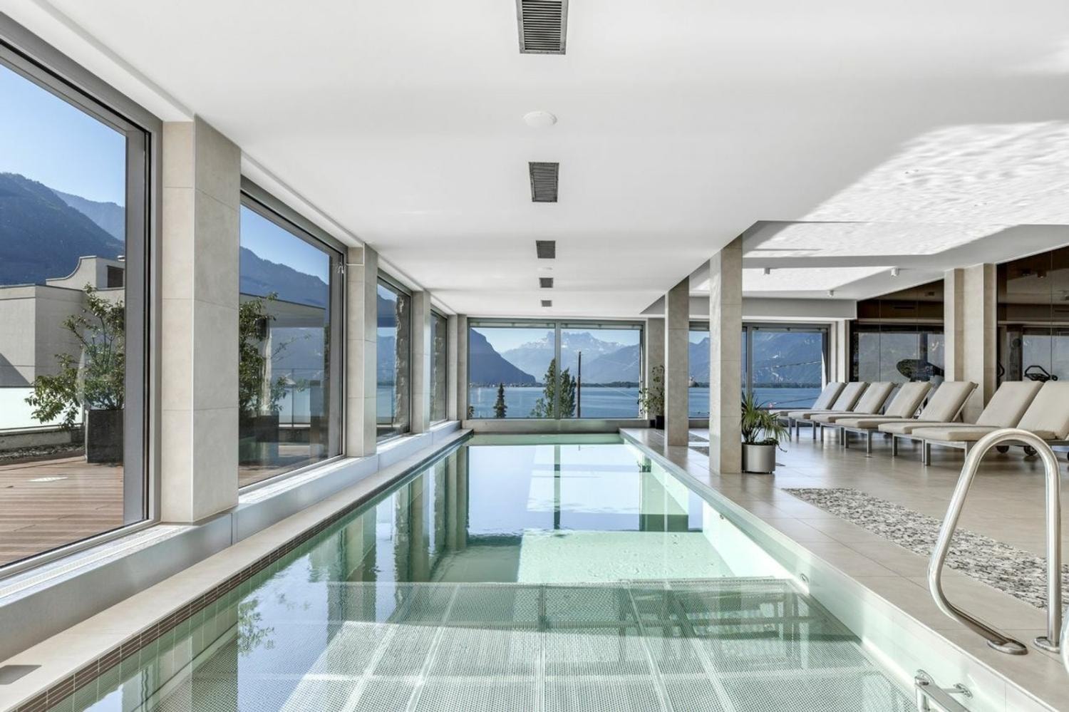 Indoor swimming pool with Lake Geneva and Alpine views, Le National residence, Montreux