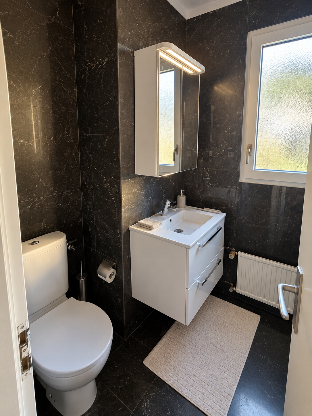 Bathroom with black marble finishes